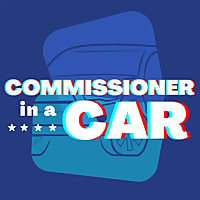 Commissioner in a Car